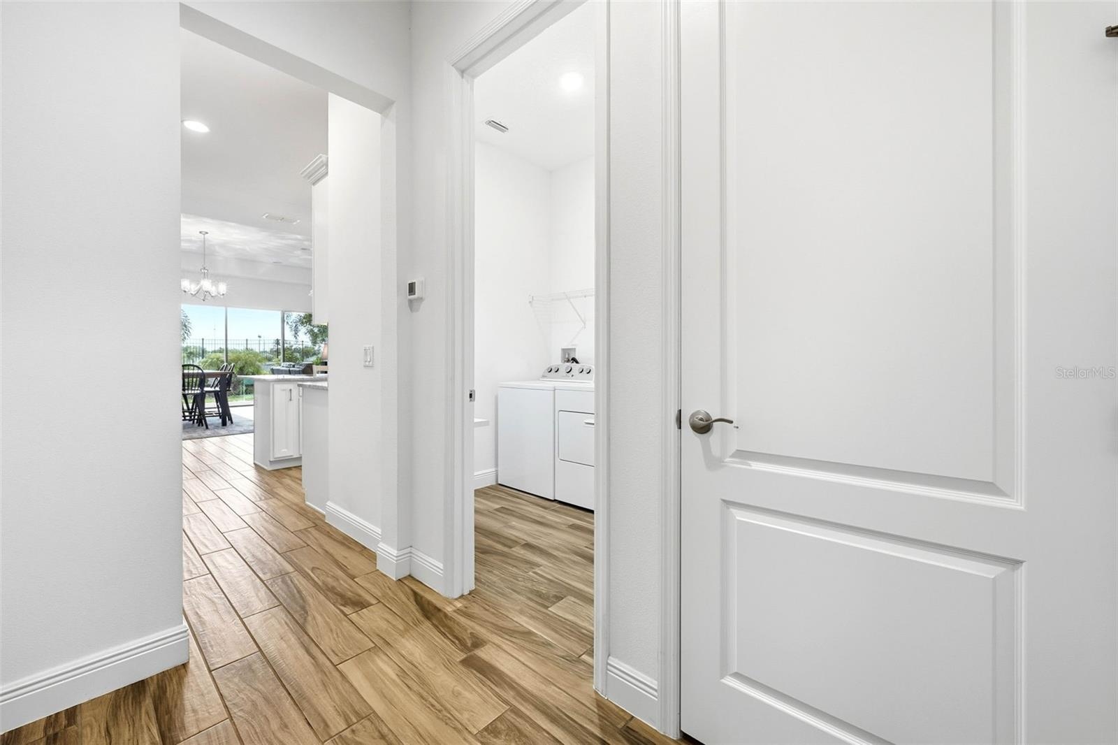 Entering from the garage to drop zone to laundry—everything in the right place for easy living!