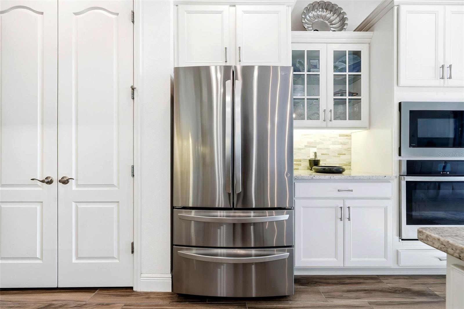 Cook, store, and entertain with ease—huge pantry, wall oven, and microwave at your fingertips!
