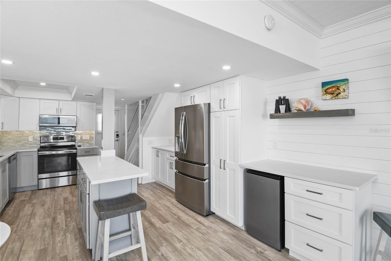 Custom Built-In Features and Island in Kitchen
