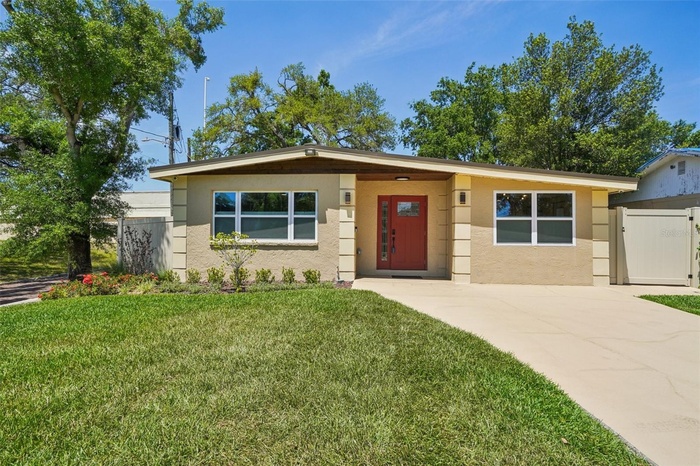 House features 50 year steel roof, maintenance free eaves and soffits,  impact windows and doors woth cedar accents