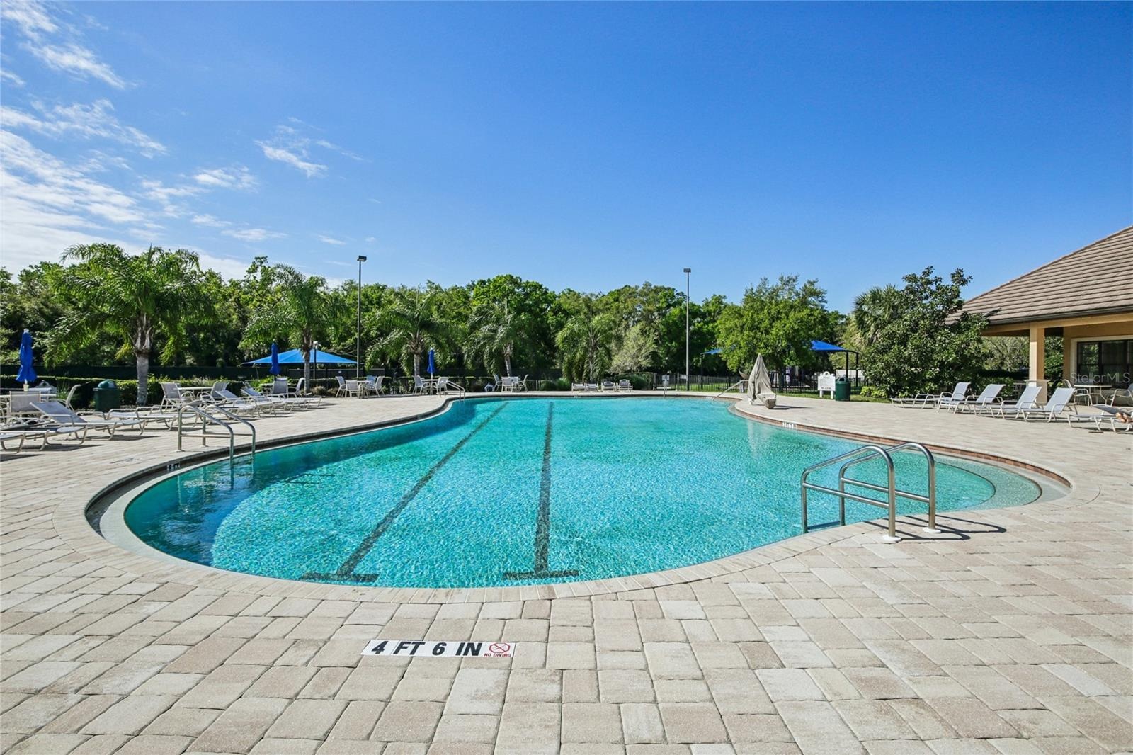 Community Lap pool with scheduled aquacise and covered space for a cool workout and social relaxing cool down.
