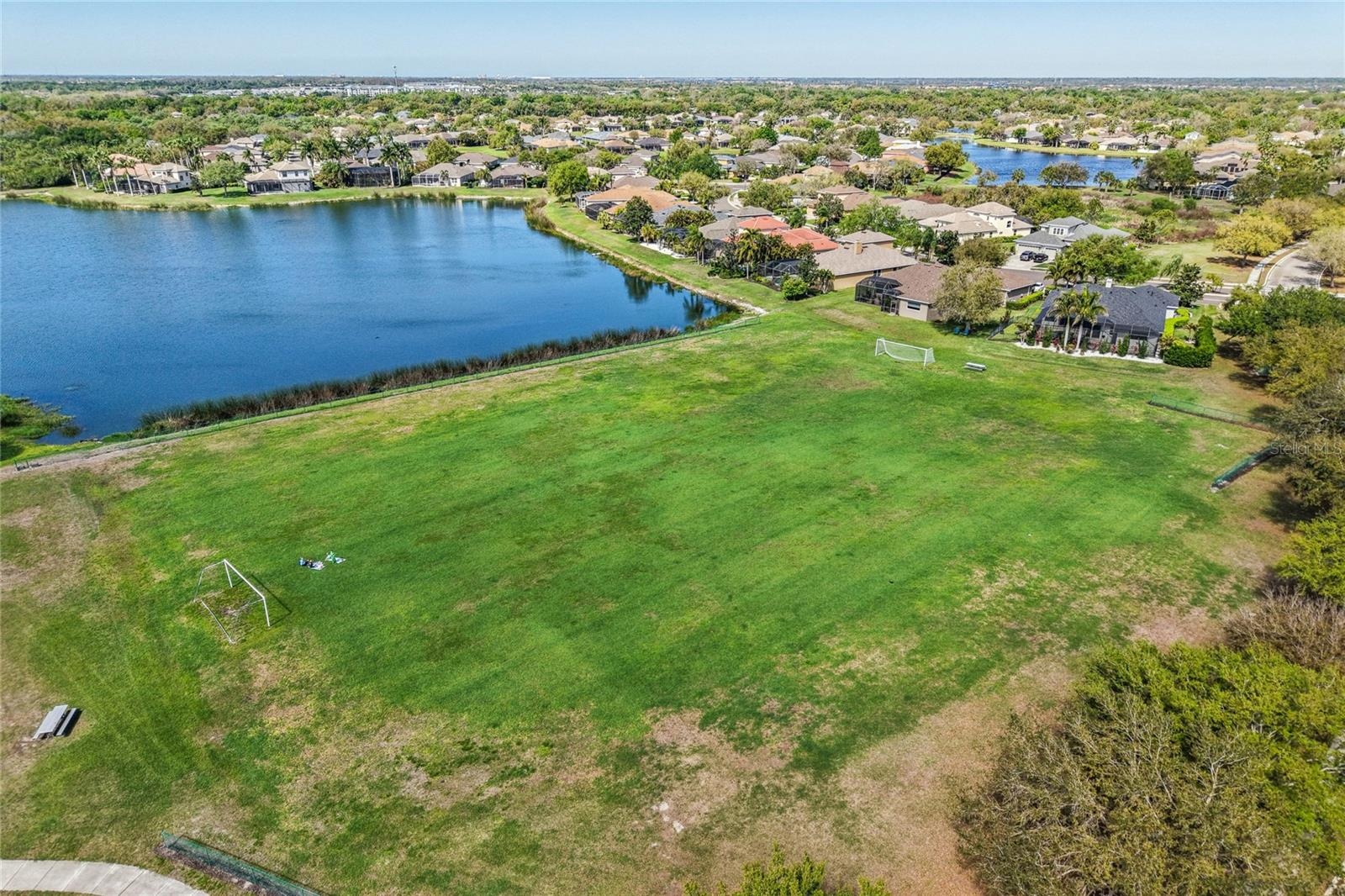 Generous lake front soccer field an unusual, impressive amenity for all families.