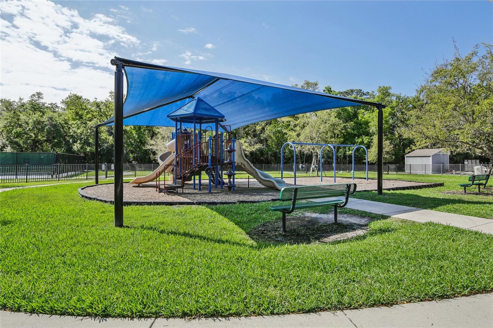 Children's covered playground to keep these children sliding all day!