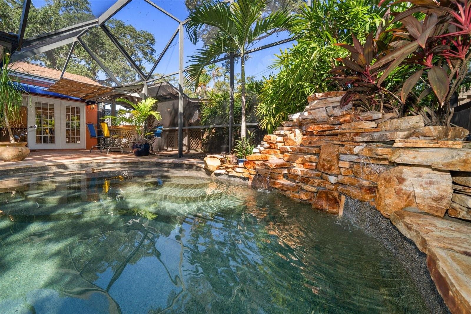 SALT WATER POOL WITH SUNSHELF AND WATERFALL