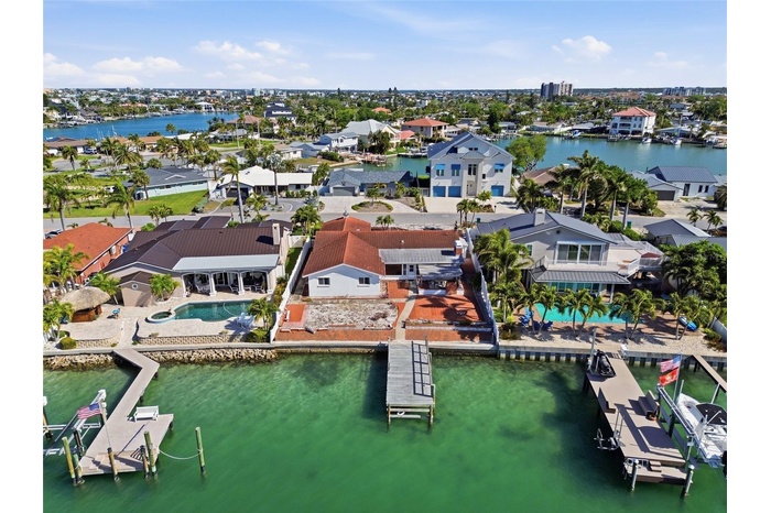 Drone shot of 4 Bellevue Drive looking south at The Devil's Elbow on the Intracoastal and the one bridge to the Gulf of Mexico in the foreground on th