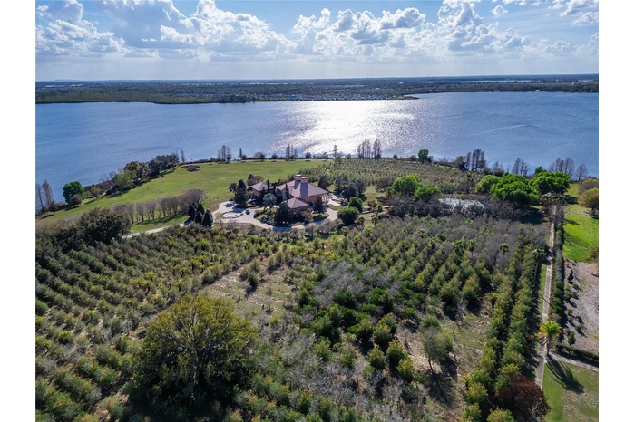 A rare opportunity to own one of Auburndale’s most impressive private estates. Set on 44.30 beautifully landscaped acres with more than 2,300 feet of 