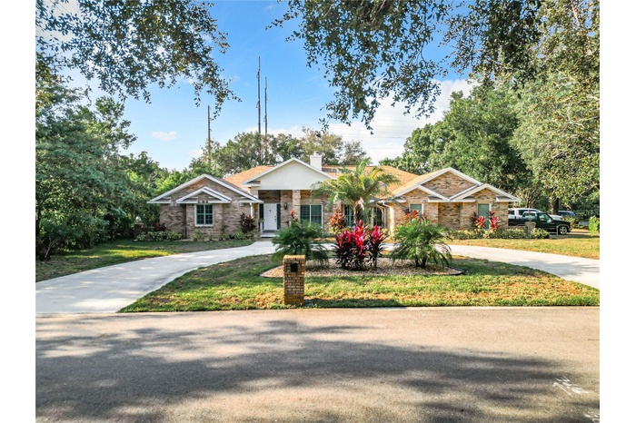 Front circular driveway leads to estately entry