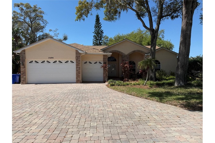 Beautiful facade with architectural details and 3 car garage.