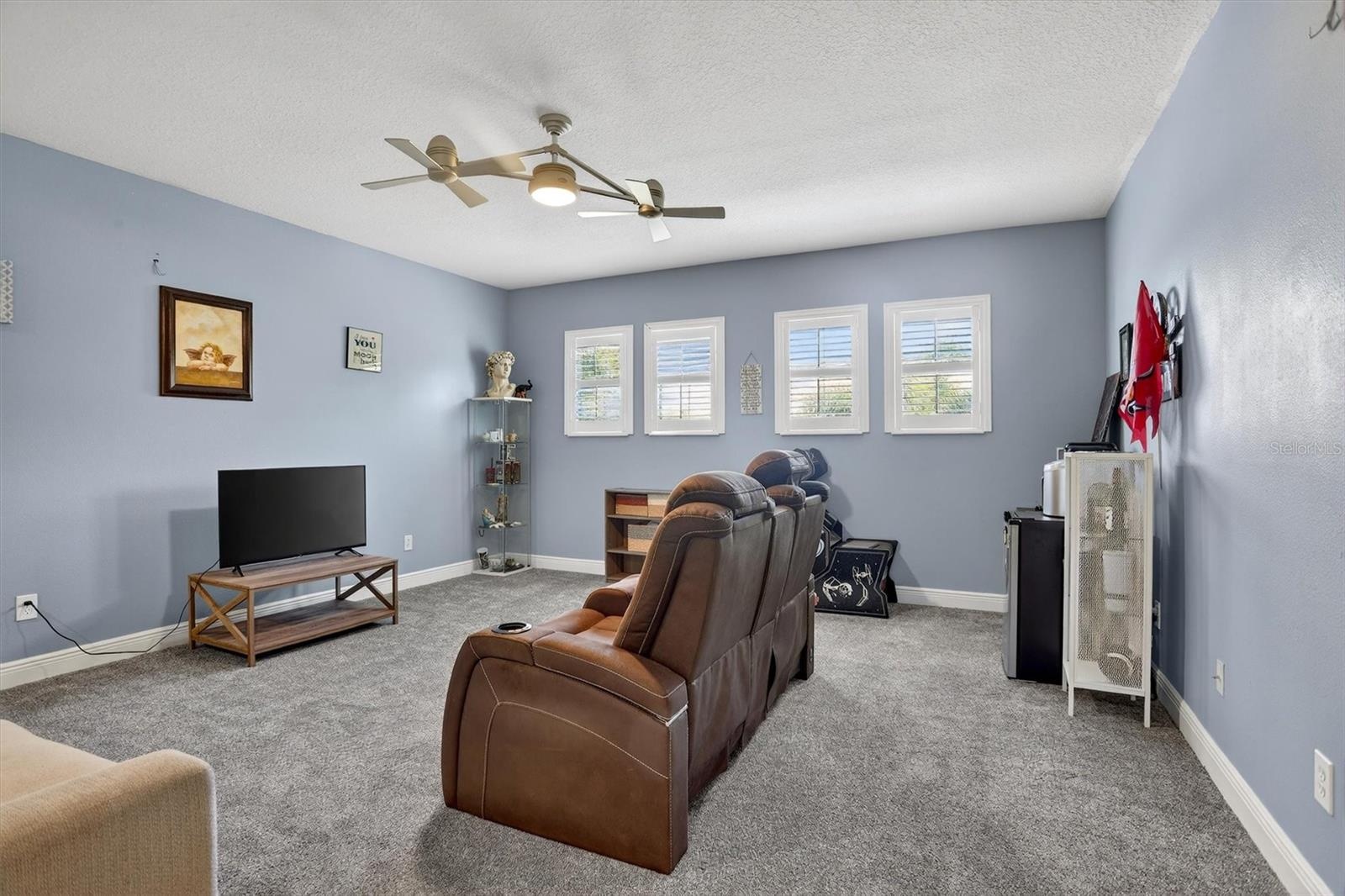 Expansive loft space ideal as a second living area, playroom, or in-home theatre.