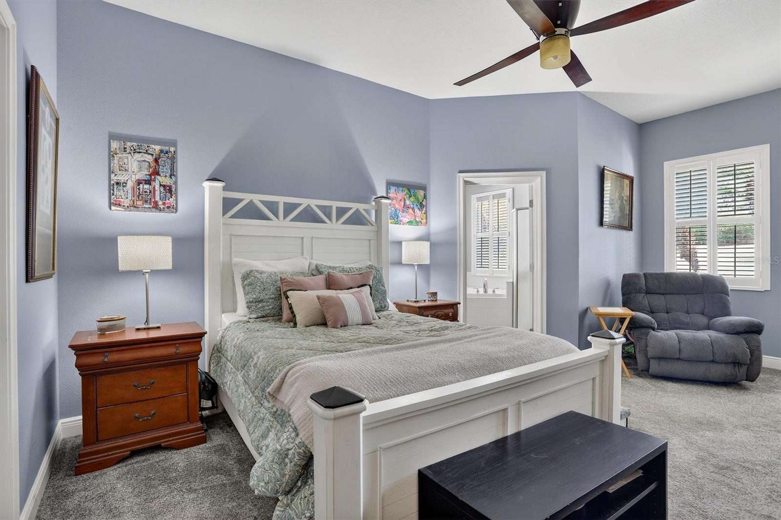 Oversized primary on the first floor with ensuite bath and door leading to lanai.