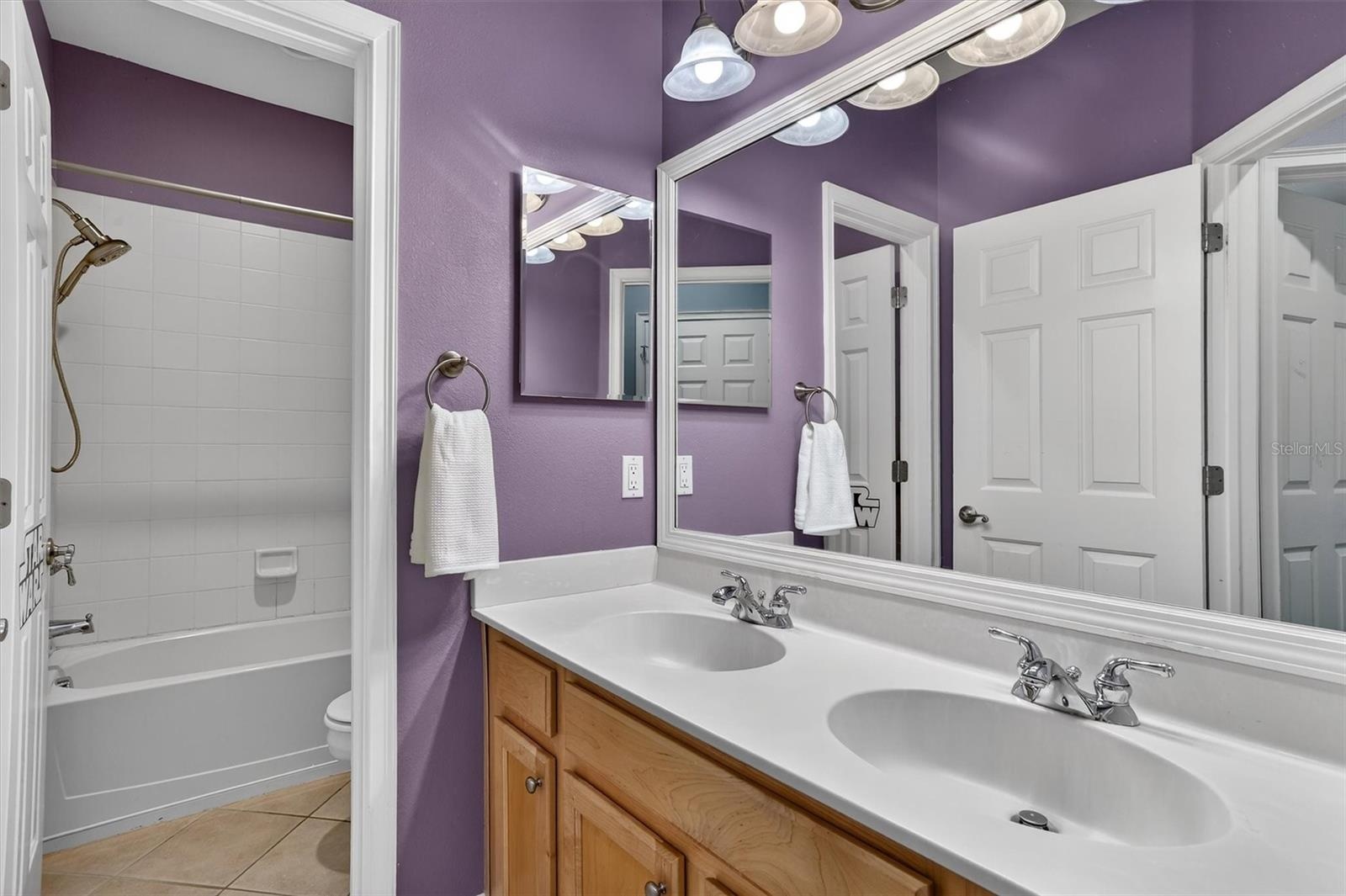 Guest bathroom on second story conveniently located for the guest bedrooms to share.