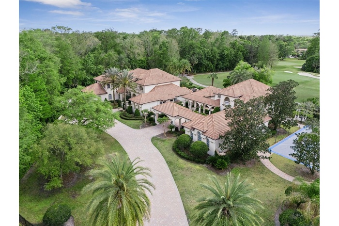 Welcome to your private compound with no neighbors on three sides, sited on 1.55 acres, gorgeous golf views of the 8th hole, separate 3100 sqft  guest