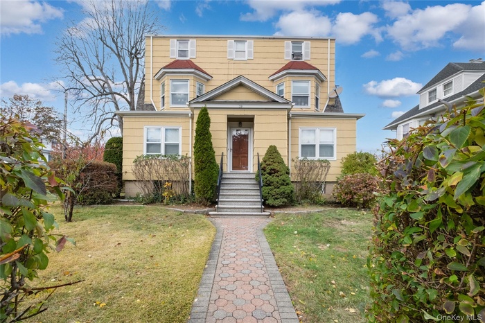 Welcome to 29 Edgewood Park; 4 family home in New Rochelle with 3 car garage, large lawn; located in a residential neighborhood