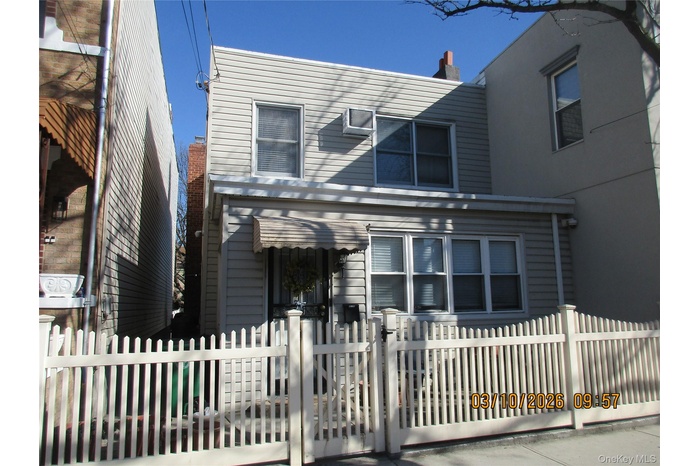 View of front of property with a fenced front yard