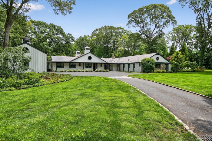 Private gated drive leading to the front of the home