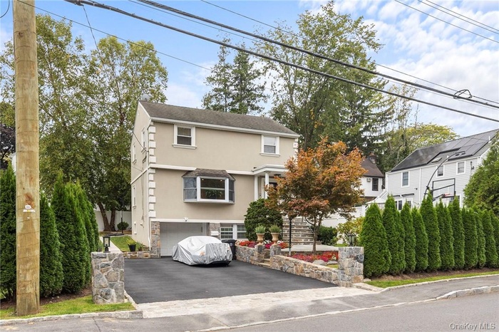 View of property with a garage