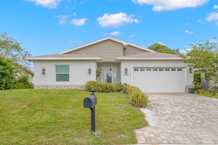 Contemporary coastal styling meets quality construction in this beautifully finished residence featuring a brick paver driveway, oversized 2-car garag