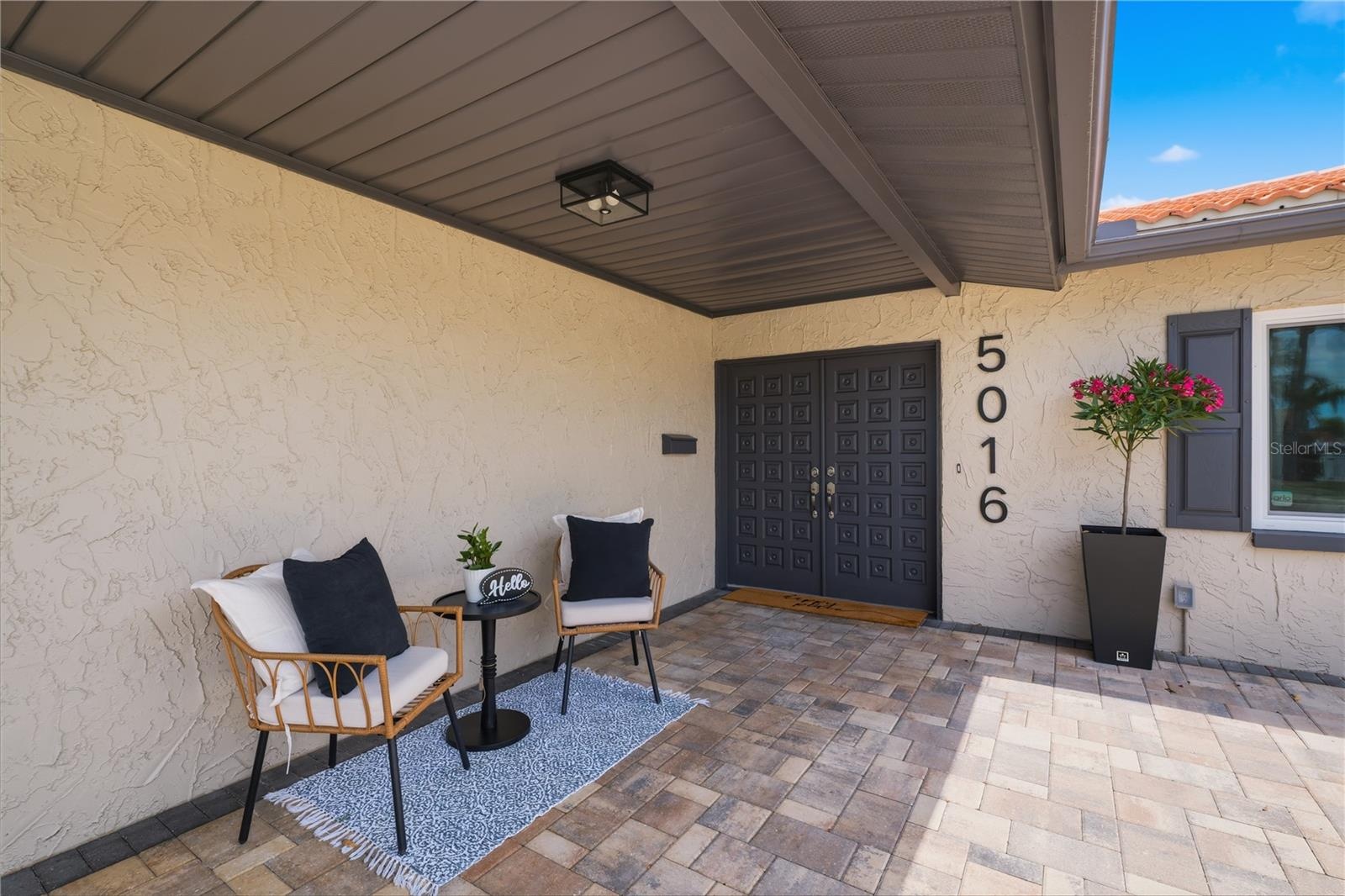 Welcoming front entry with double front doors