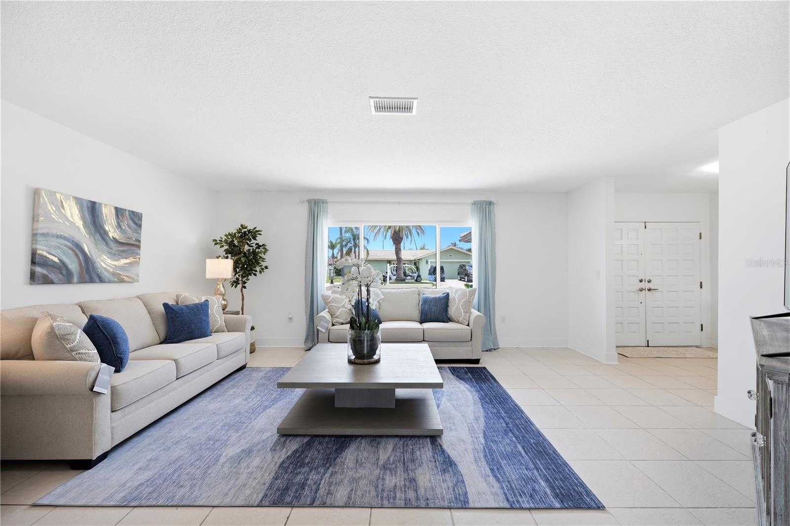 large picture window in living room brings in lots of natural light