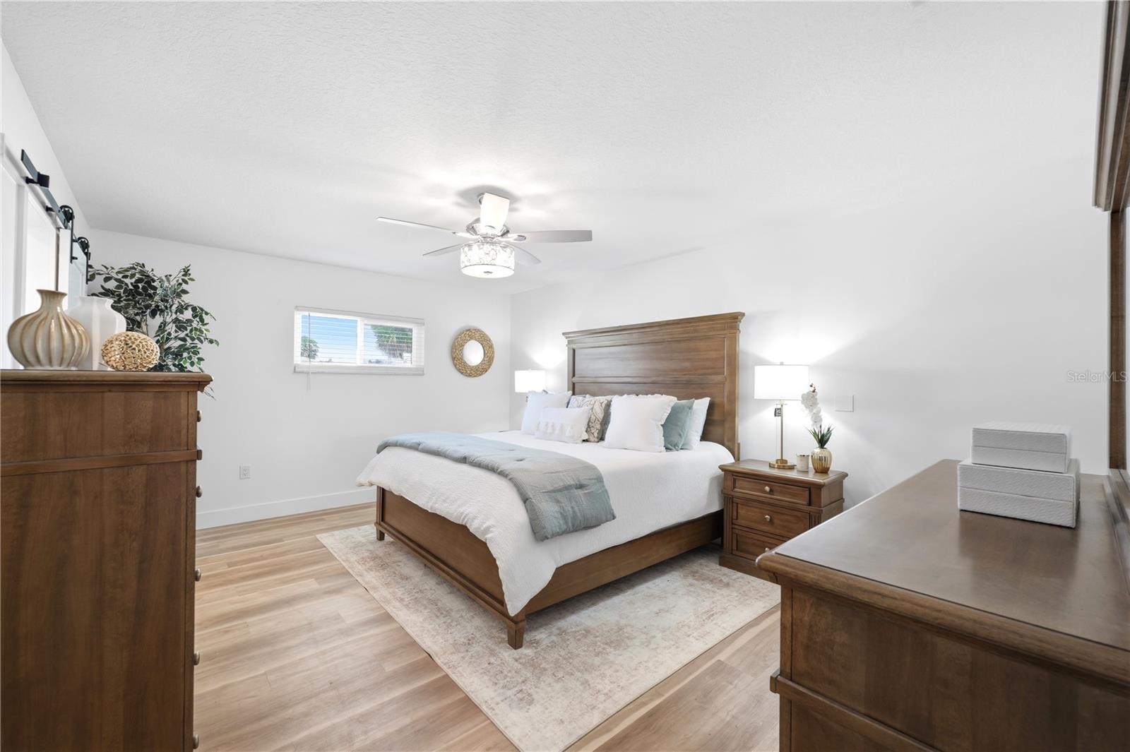 large primary retreat tastefully decorated with upgraded lighting and ensuite bathroom