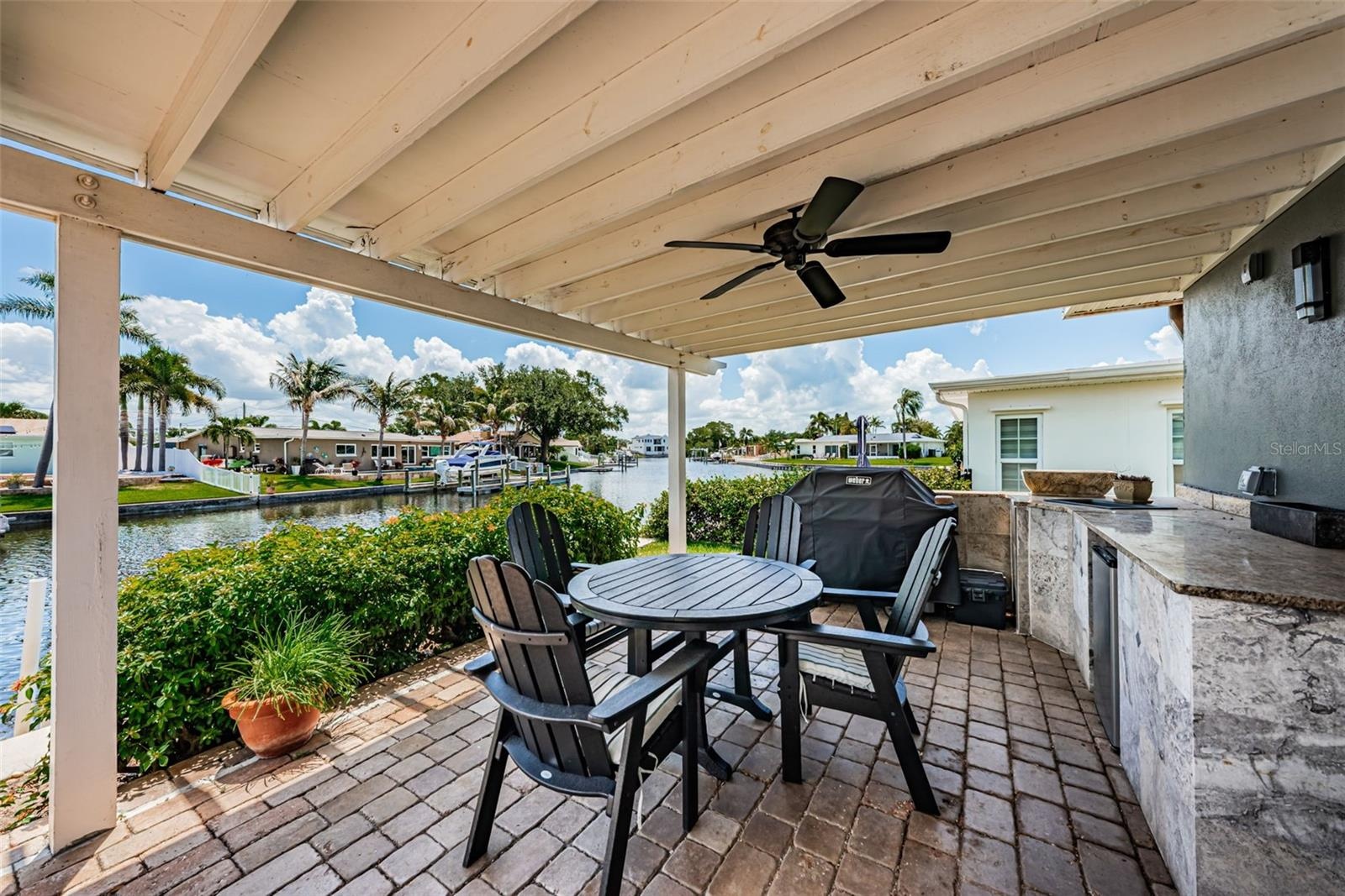 Covered shade space with pavers & a kitchen area