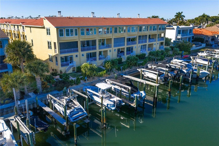 Waterfront Back of building with personal oversized boat slip