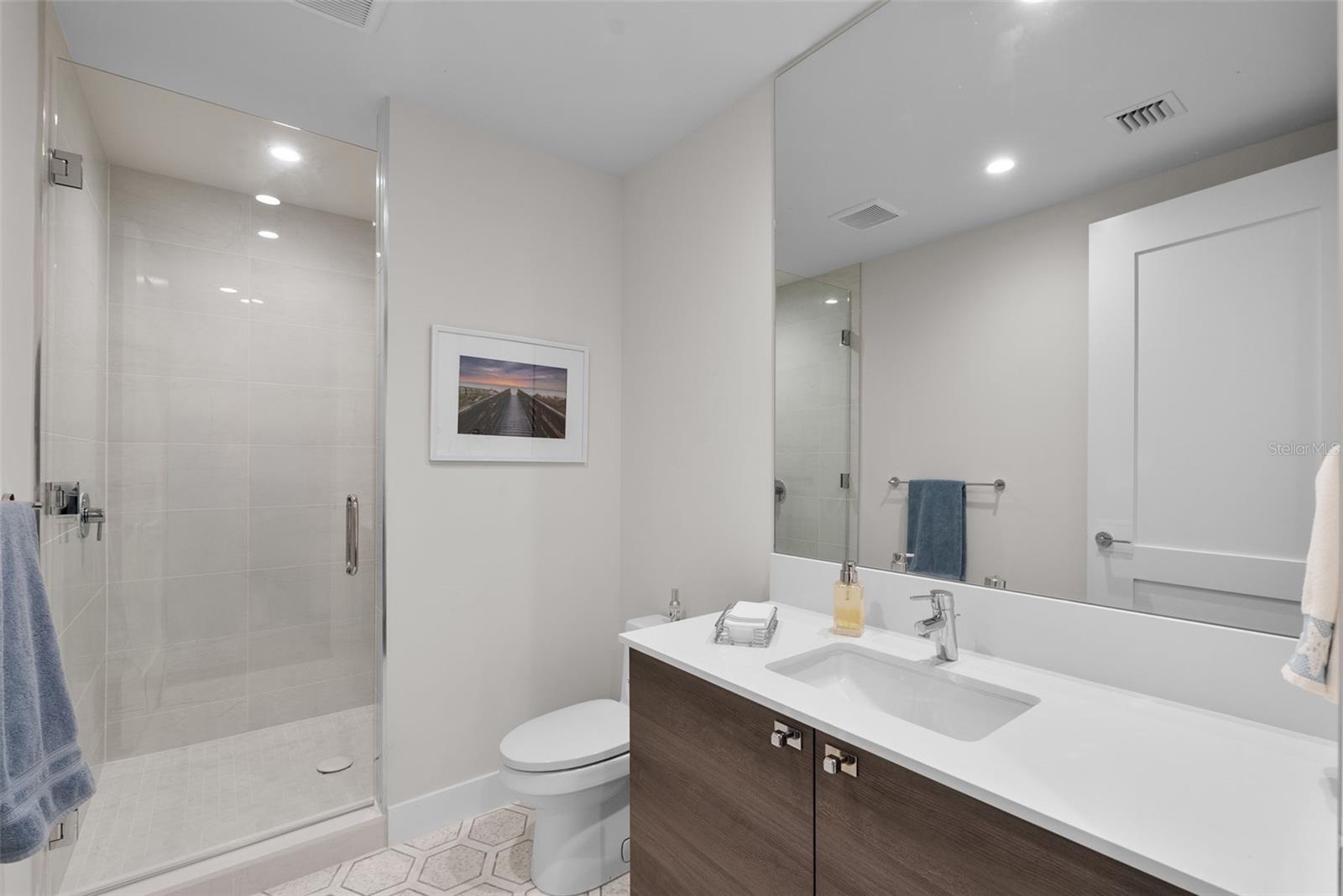 Bathroom #2 with upgraded mosaic tile in hallway