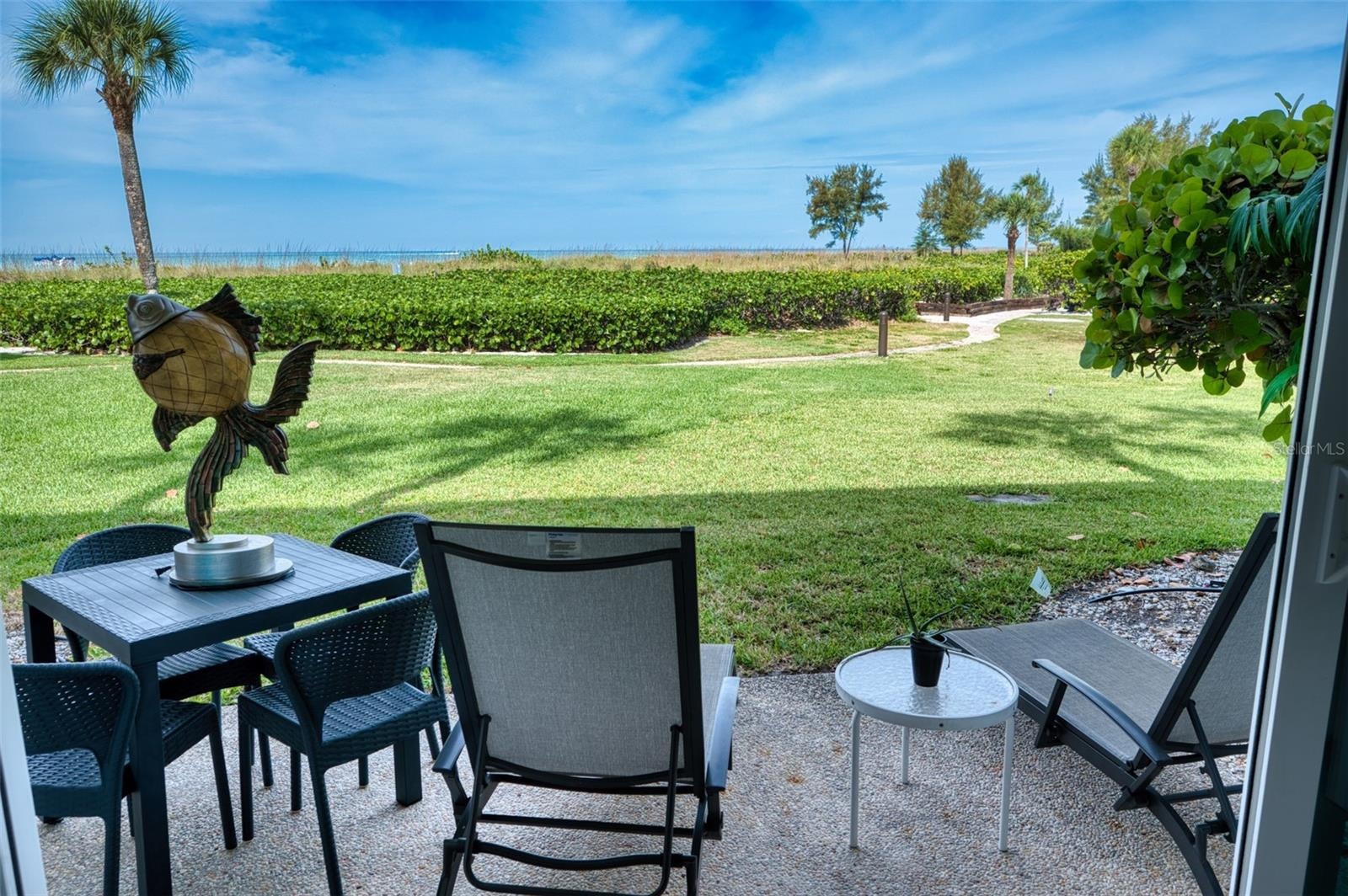 Rear patio tucked behind the sand dune with views of the Gulf waters.
