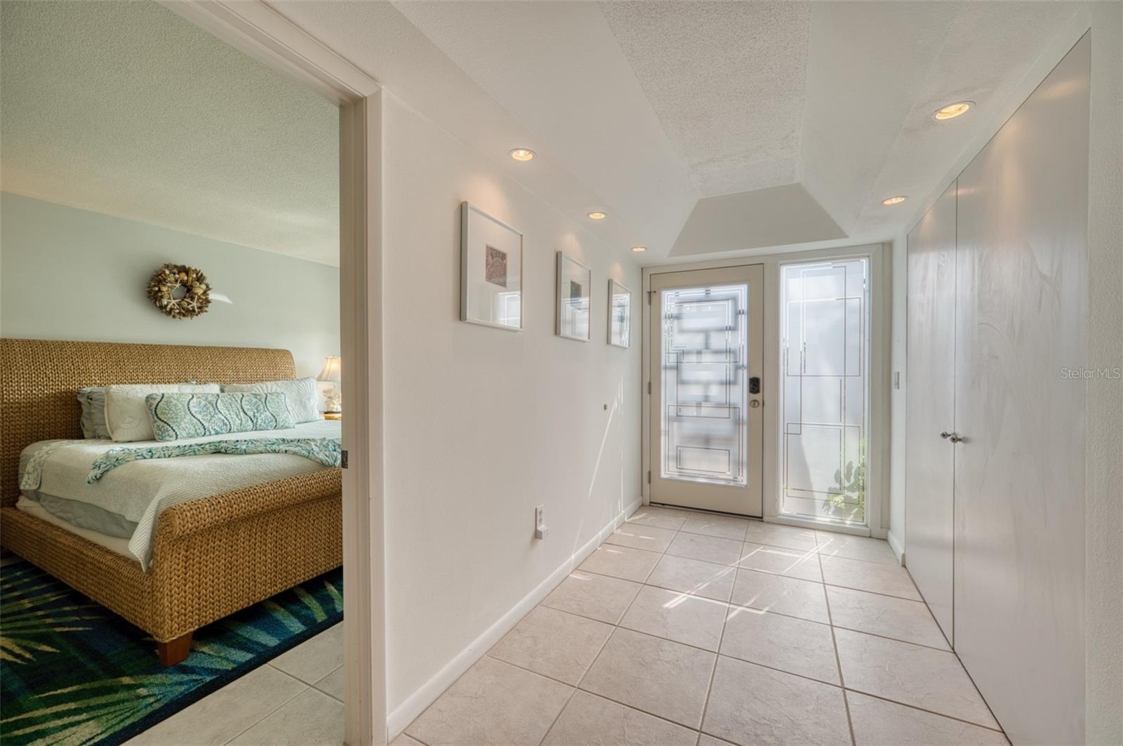 Clean bright hallway entrance to master bedroom