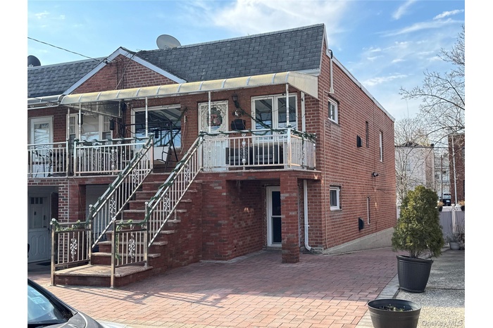 View of building exterior featuring stairway
