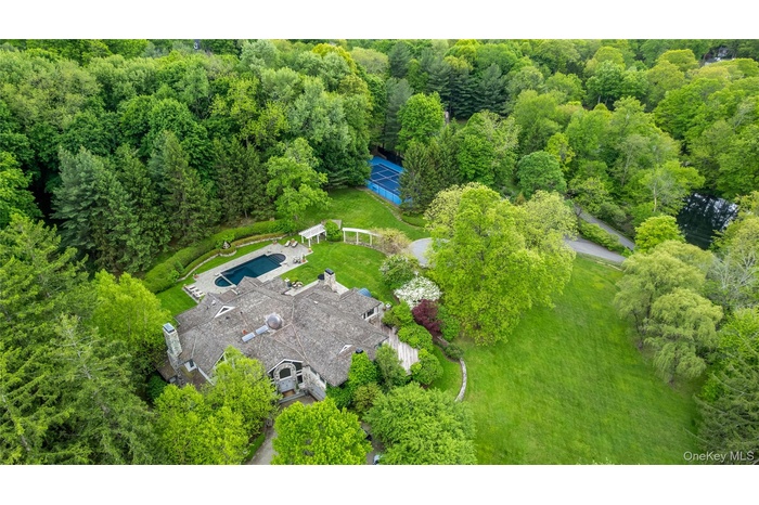 Welcome home.  150 Old Farm Road North is a gated playground with gorgeous home, pool and tennis on a hilltop setting with more than four acres.