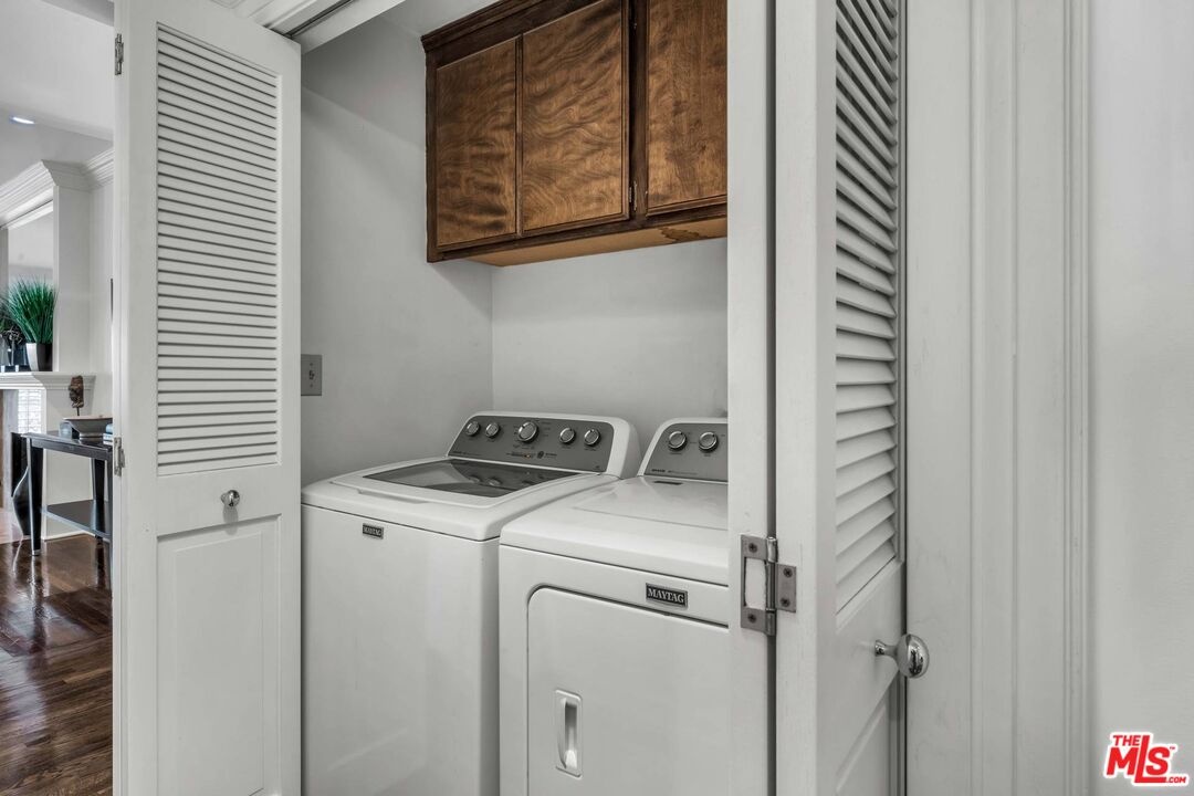 Laundry closet with side-by-si