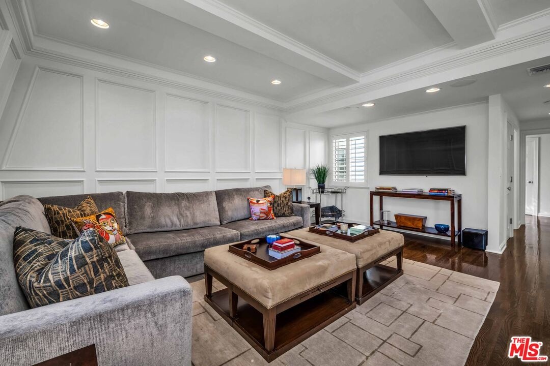 Family room with white paneled