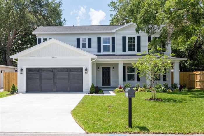 Welcome home to 3414 W. Cherokee Ave! Large inviting front porch and pretty landscaping.