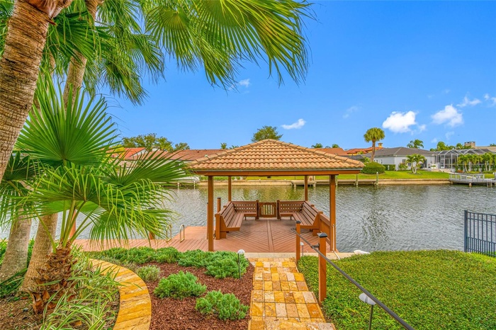 Travertine pathway to water and gazebo