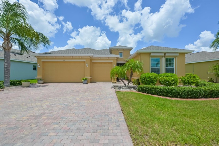 Executive Style Home - 3 car garage, custom pavered driveway and electronic Hurricane shutters!