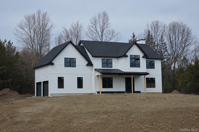 We are building this same home as following photos but with a more modern urban farmhouse look.  This home is up on another site - black windows are a