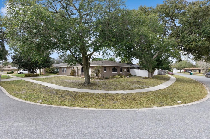 Welcome home to this Large Corner lot flowing into a cul de sac