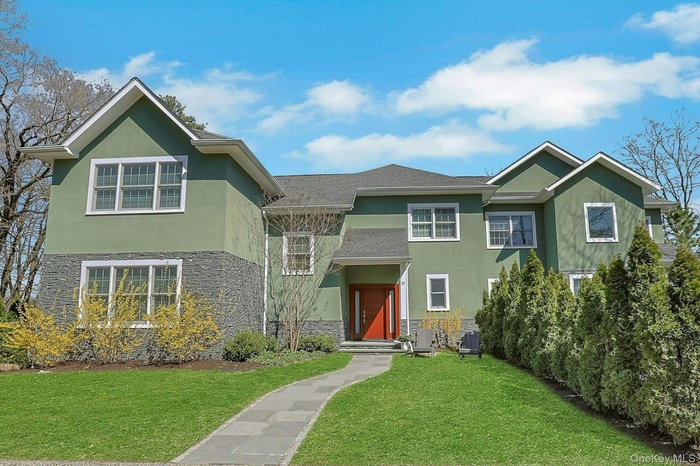 Welcome to 28 Rose Street - one of the two-unit side-by-side townhomes...  arborvitaes separate the two front entrances