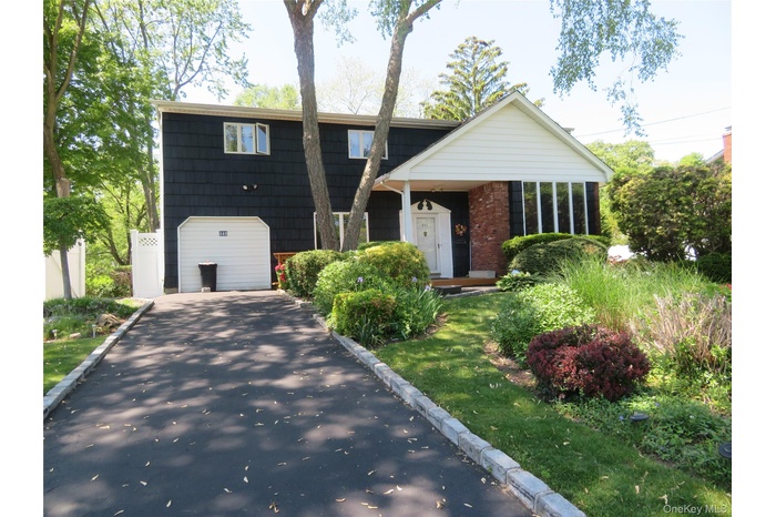 Cedar shakes with brick & vinyl siding