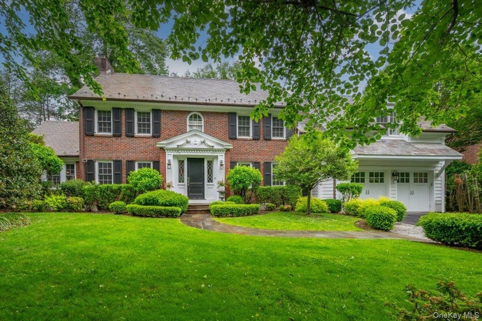 Welcome to this Red Brick Colonial nestled in the heart of Scarsdale's sought-after Fox Meadow neighborhood.