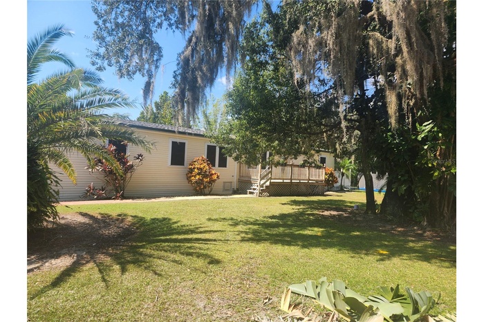 FRONT PORCH OVERLOOKING AN EXPANSIVE CORNER LOT