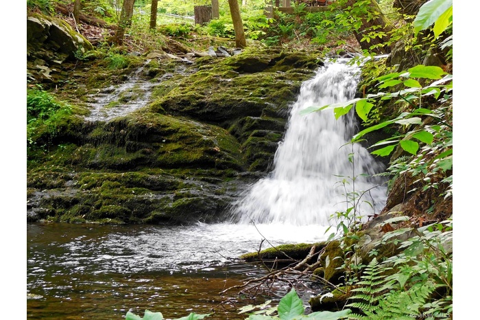 Your own private sanctuary w/ a cool refreshing mountain stream, TWO Cascading Waterfalls & an abundance of nature!