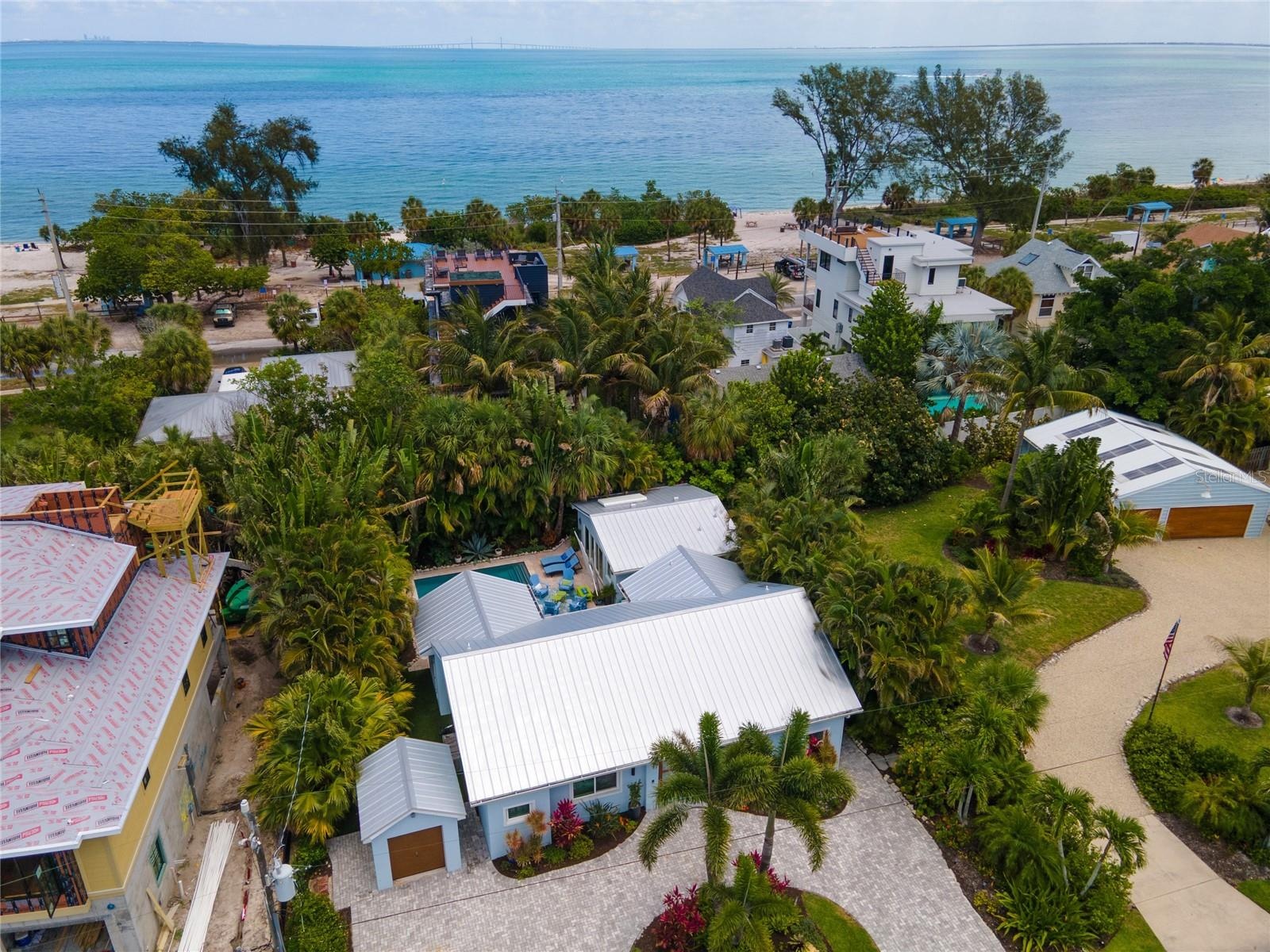 Aerial view of the property which also shows the parcel at 240 Gladiolus available for separate purchase which has 10,600+ squ ft of land and a large 