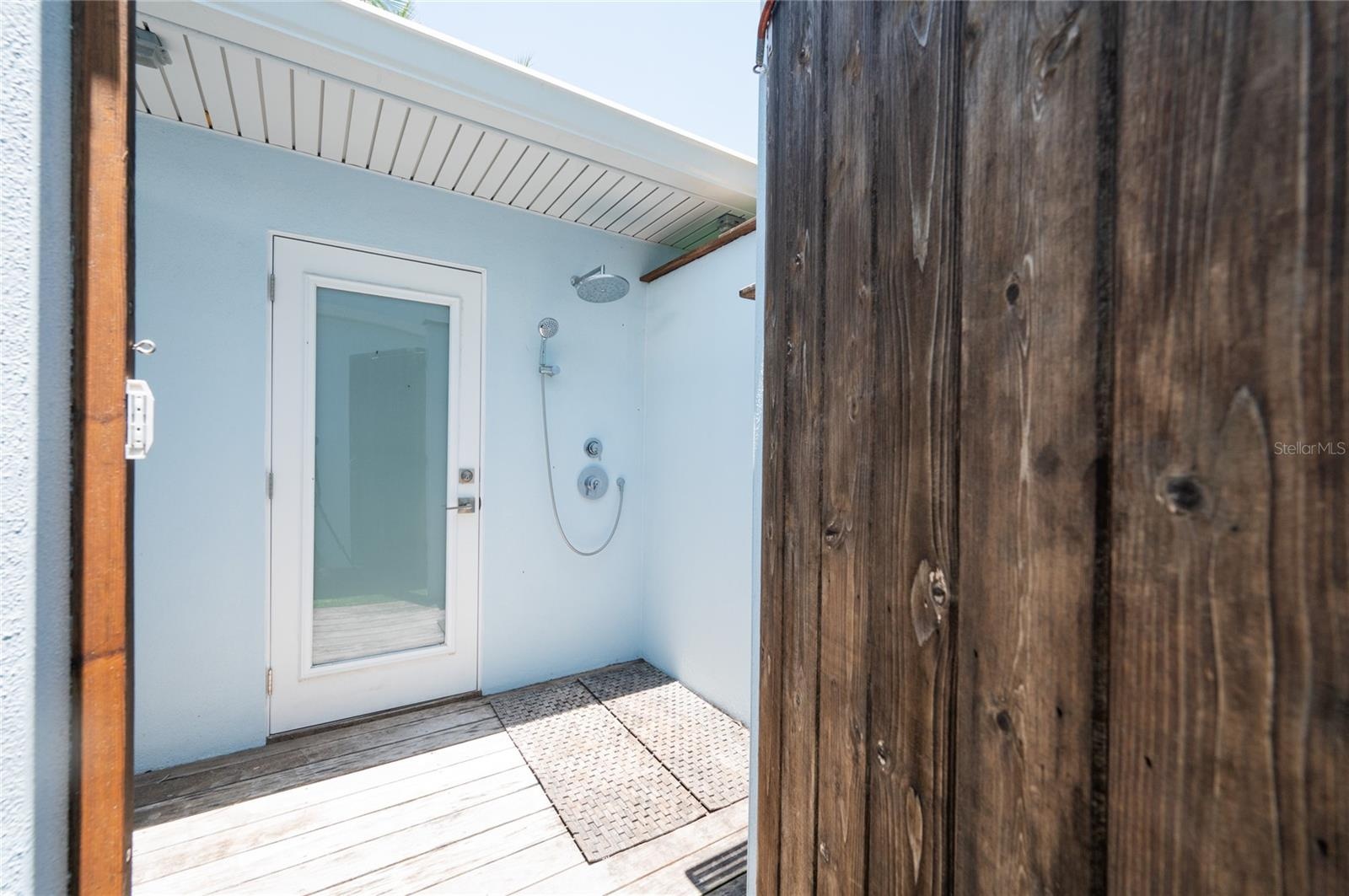 Outside shower with hot and cold water and features a door that goes directly into the Casita half bathroom