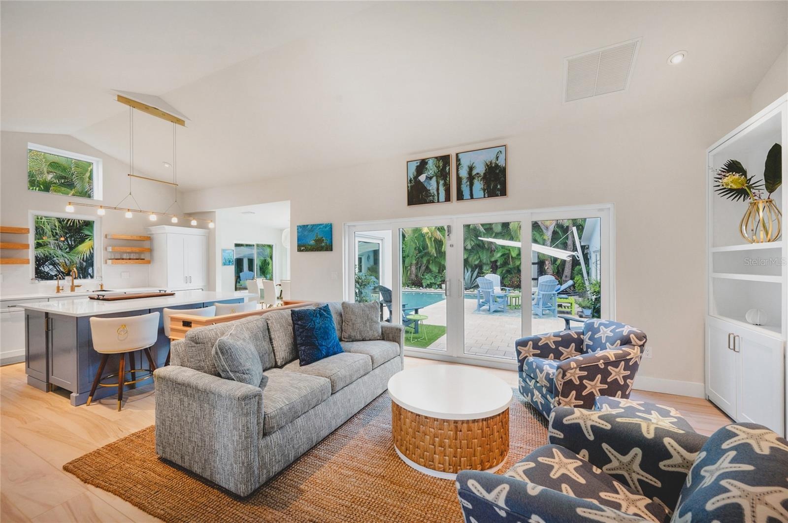 Living room with all new furnishings and decor and original artwork by local artists
