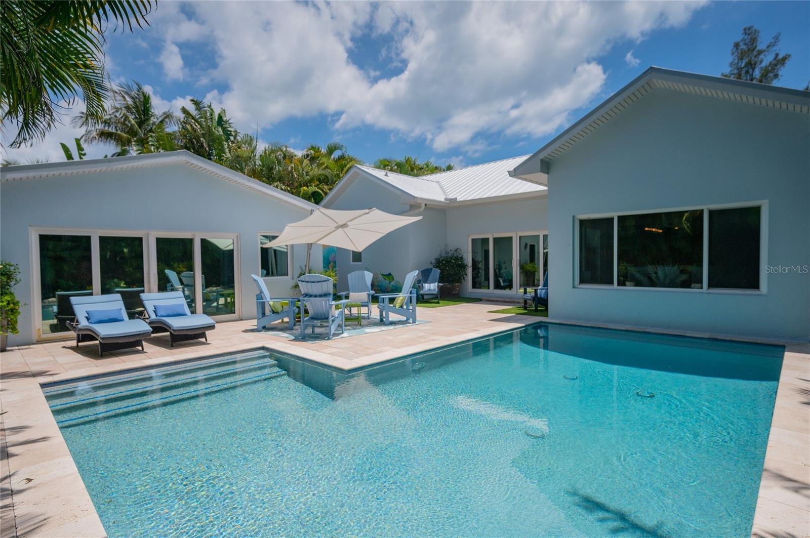 Plenty of lounging and seating in a private tropical setting