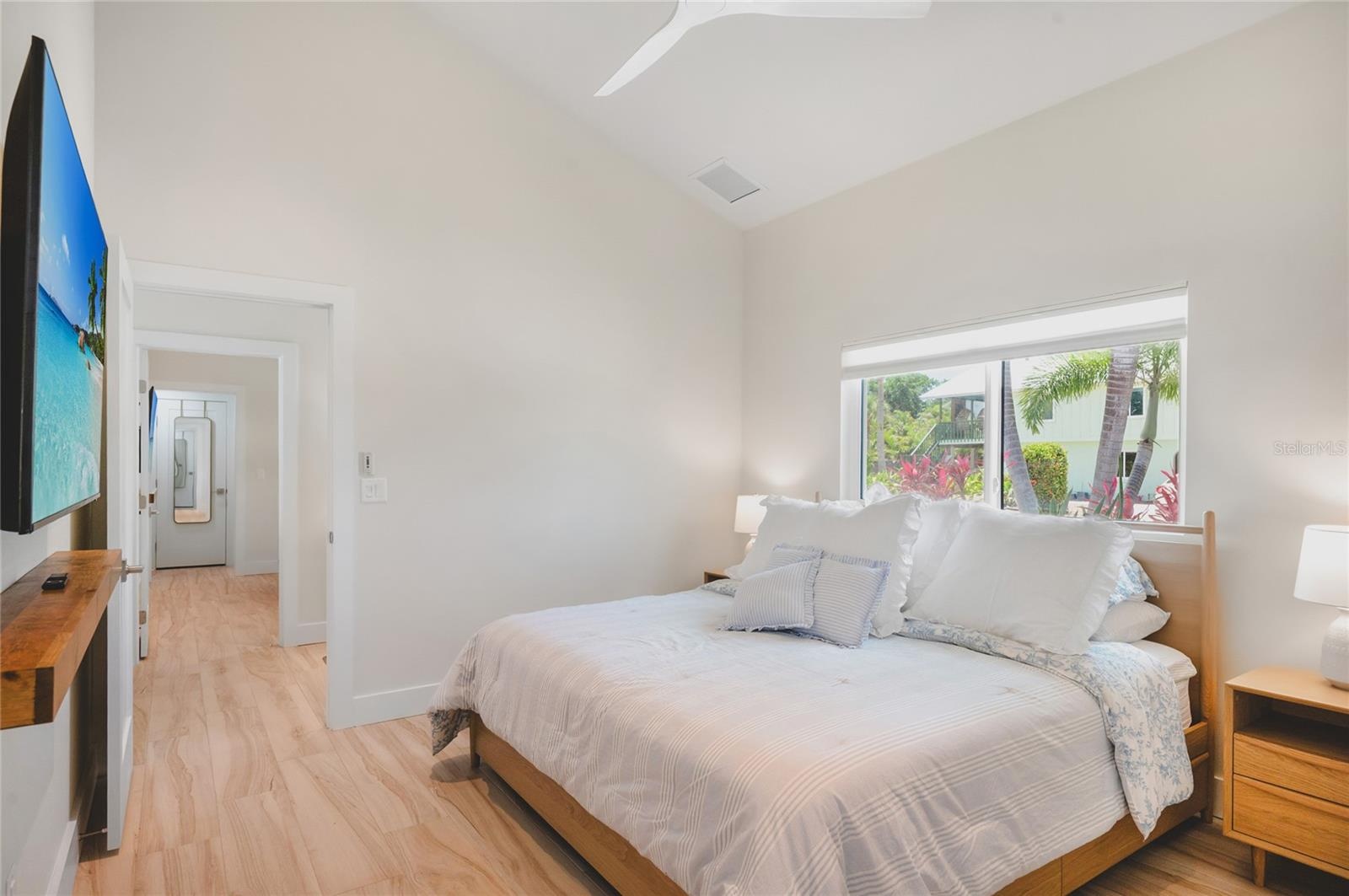 Guest bedroom with vaulted ceilings