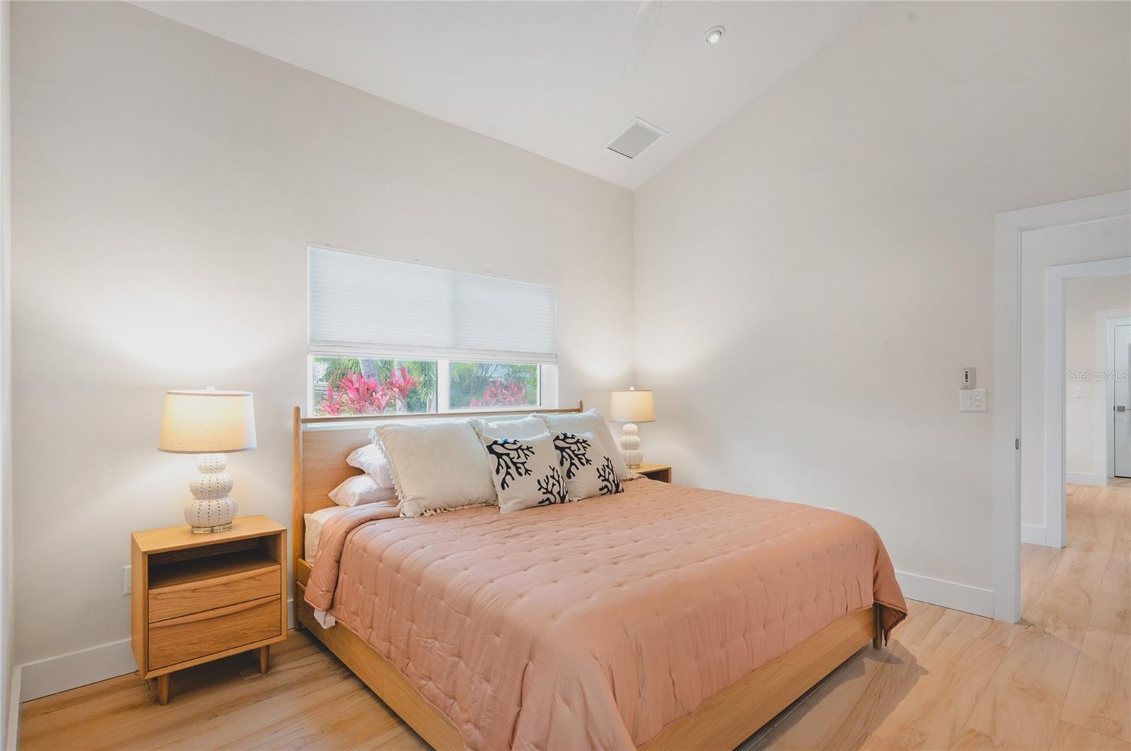 Guest bedroom with vaulted ceilings