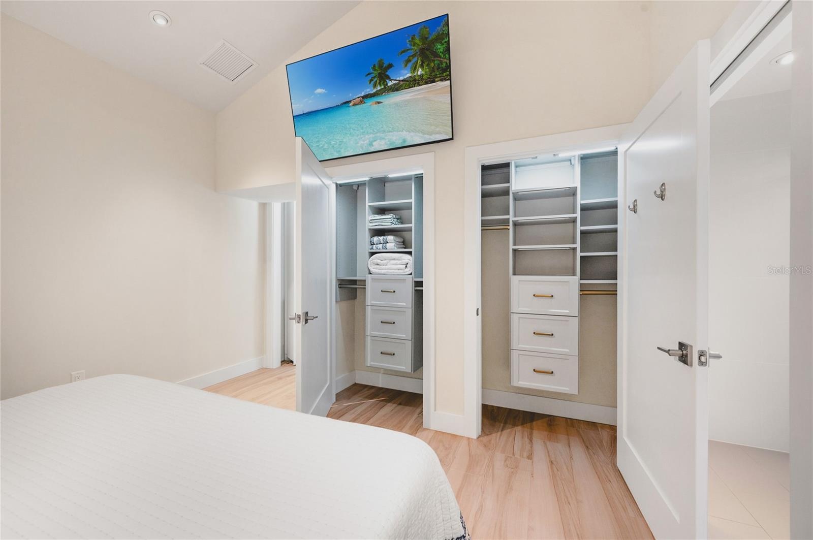 Primary bedroom closets with custom built ins